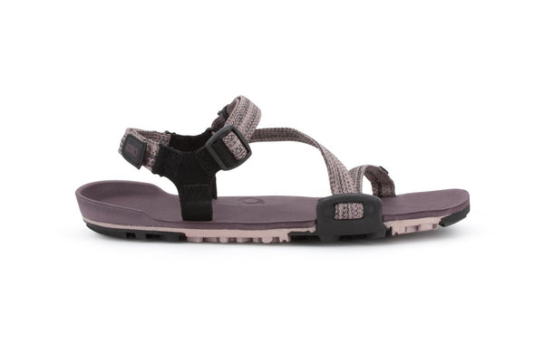 Dusty Rose Z-Trail - flat gray-pink sport sandal with paler pink treads on the bottom. This colourway features gray-pink z-shaped strapping at the front and an adjustable ankle strap at the back. Two black slide buckles are shown at the side of the sandal.