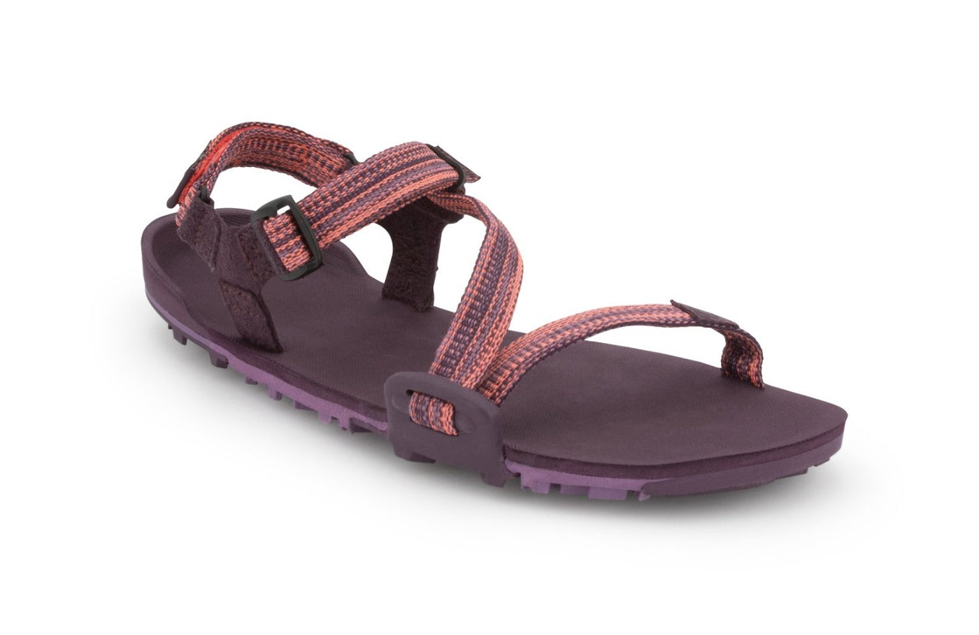 Magenta Z-Trail, flat dark purple sport sandal with lighter purple treads on the bottom. This colourway features subtle pink and purple multi-coloured z-shaped strapping at the front and an adjustable ankle strap at the back. Two purple slide buckles are shown at the side of the sandal.