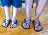 Two people's feet wearing Xero Barefoot Shoes with royal blue laces
