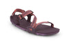Magenta Z-Trail, flat dark purple sport sandal with lighter purple treads on the bottom. This colourway features subtle pink and purple multi-coloured z-shaped strapping at the front and an adjustable ankle strap at the back. Two purple slide buckles are shown at the side of the sandal. 