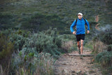 Person running on a trail in Xero Lightweight Minimal TerraFlex Trail Runner