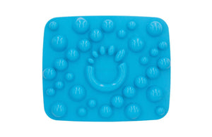 Blue plastic Rox Mat with raised texture made of cirlces of various sizes.