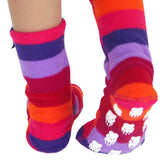 cozy fleece socks for children with stripes of pink, purple, red, orange and lavender, with white bear paw non-slip pattern on bottoms 