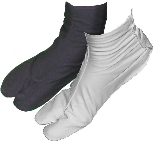 one white tabi sock and one black tabi sock.